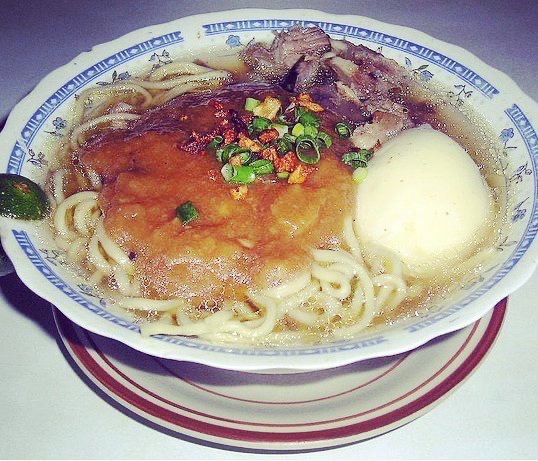 kinalas noodles and broth in bowl