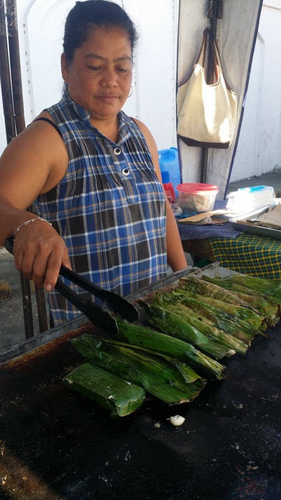 Woman cooking Tupig in Ilocos